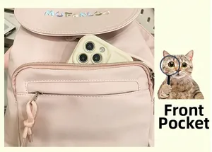Detailed view of the front zipper pocket with phone storage on the pink nylon backpack