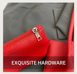 Detailed close-up of premium red lychee pattern leather and silver zipper hardware