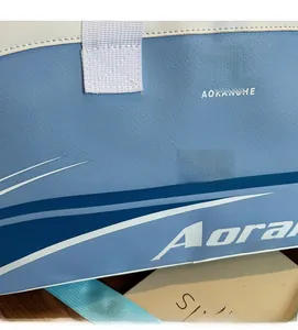 Detailed close-up of blue and white cross-grain fabric and logo on sports gym bag