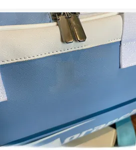Detail of cross-grain PU leather texture and AORANSHE logo on the light blue sports bag