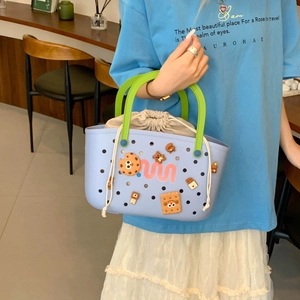 Detail of light blue waterproof EVA shower basket with cute charms and inner canvas bag