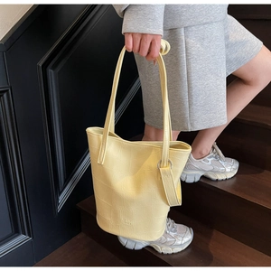 Crocodile pattern oil wax leather bucket bag with metallic ring and MER PAI logo