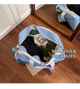Large blue and white sports travel bag showing spacious interior with personal items
