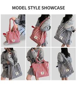 Detail view of large striped canvas tote bags in red and blue color options