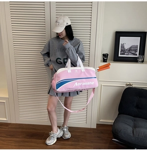 Pink and white sports fitness bag with a side opening for a badminton racket