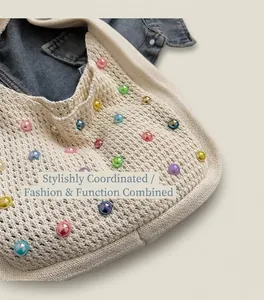 Detail of knit tote bag with colorful pearlescent beads and soft texture finish