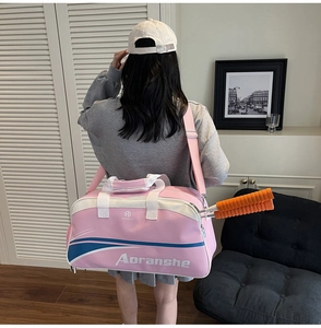 Pink waterproof sports bag showing storage capacity for two badminton rackets