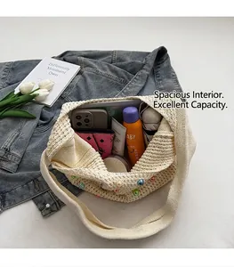Detailed top view of a woven tote bag with colorful pearl beads and a large interior