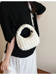 Chic beige quilted cloud bag with pleated design and adjustable shoulder strap for women