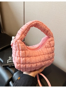 Pink quilted cloud bag with top handle and crossbody strap, soft mini dumpling style purse