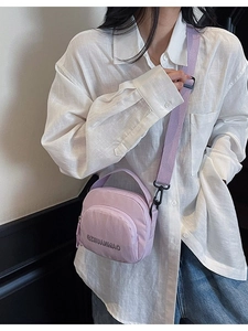 Stylish light purple canvas crossbody bag for women with adjustable shoulder strap