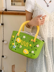 Green EVA hollow basket with yellow handle and cute charms for bathroom storage