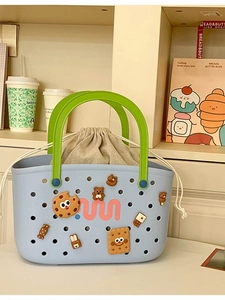 Blue hollow-out tote bag with green handles and cute cartoon DIY accessories charm