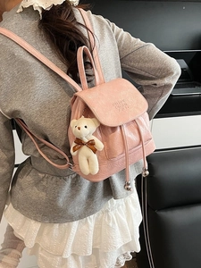 Pink PU leather bucket backpack with bear plush charm and drawstring cover for women