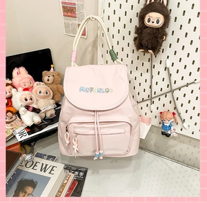 Detailed view of pink nylon backpack with MUFANLUO embroidery and colorful drawstring