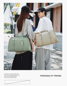 Outdoor lifestyle shot of large nylon travel handbags in sage green and khaki colors