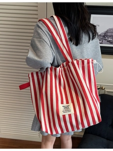 Minimalist red and white striped canvas tote bag with drawstring for daily casual commute