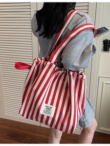 Red and white striped canvas tote bag with shoulder strap for daily casual use