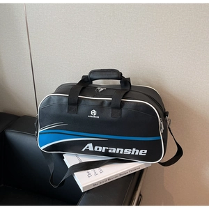 Close-up of Aoranshe sports bag on a leather sofa showing dual handles and sleek blue design