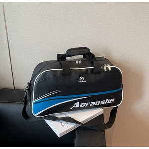 Detail of black sports bag with blue dynamic stripes and adjustable shoulder strap