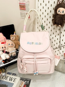 Pink lightweight nylon backpack with colorful braided handles and embroidery