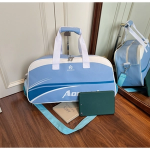 Detail of light blue and white travel bag with adjustable strap and spacious compartment