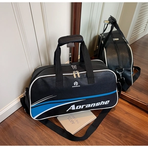 Detail view of durable black sports bag with blue stripes and dual metal zippers