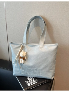 Sky blue minimalist tote bag with H.SHAN logo and cute plush bear charm decoration