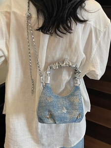 Blue denim crossbody bag with 3D silver butterflies and metallic pleated handle
