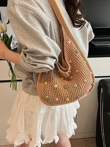 Bohemian crochet hobo bag with colorful beads and large capacity for beach vacations
