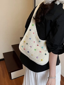 White knit hobo shoulder bag with colorful beads for beach and summer vacations