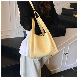 Close-up of cream crocodile pattern tote bag featuring a high-quality textured finish