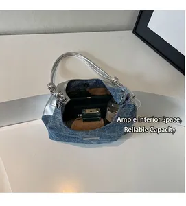 Top view of blue denim tote bag interior showing capacity for umbrella and perfume