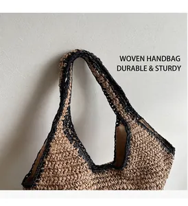 Detail of woven straw tote showing dual-tone texture and sturdy triangular structure