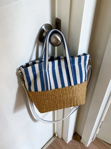 Striped canvas and straw woven tote bag with blue white stripes and shoulder strap