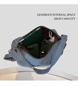 Detail view showing large capacity denim tote bag interior with iPad and daily essentials