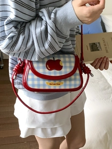 Blue and white plaid crossbody bag with red apple motif and knot shoulder strap