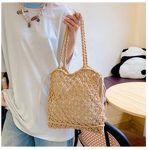Detail of hand-woven macrame tote bag featuring cross-grid pattern and drawstring lining