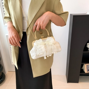 Elegant white tweed chain bag with large pearl bow and golden metal clasp for women