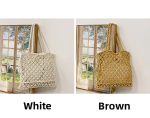 Detail of woven tote bags in white and brown with decorative side tassels and long straps