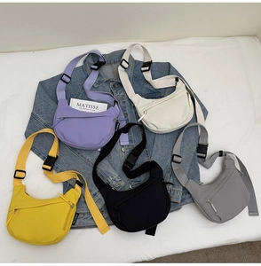 Macro detail of high-quality nylon crossbody bags in five colors with durable zippers