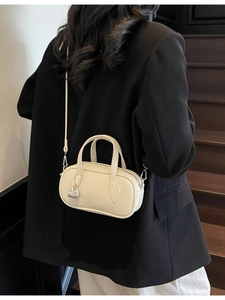 Chic cream white pebble leather mini Boston bag with silver lock charm and strap