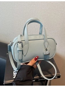 Chic light blue mini Boston bag in premium pebble leather with silver lock charm