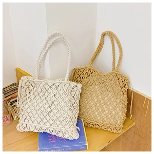 Detail of handwoven cotton rope tote bags with hollow patterns and drawstring liners