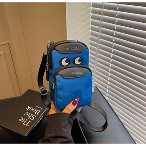 Blue nylon mini crossbody bag featuring a cartoon eye print and an adjustable strap