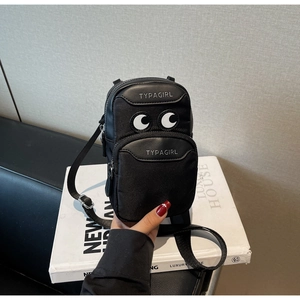 Detail of black nylon crossbody phone bag with eye embroidery and double zipper closure