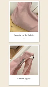 Detail view showing smooth metal zipper and textured soft pink fabric of the crossbody bag