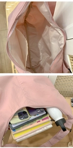 Detail of pink nylon dumpling bag showing interior lining and large storage capacity