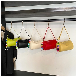 Mini cylinder crossbody bags in five colors with lychee texture and colorful bead charms
