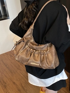 Retro bronze pleated baguette bag underarm style with vintage distressed leather texture